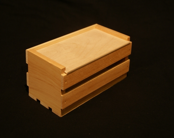 Custom wood crate with solid slide top and slats on sides and bottom.